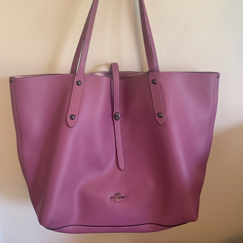 Pink Coach tote bag with shimmery pink handles
